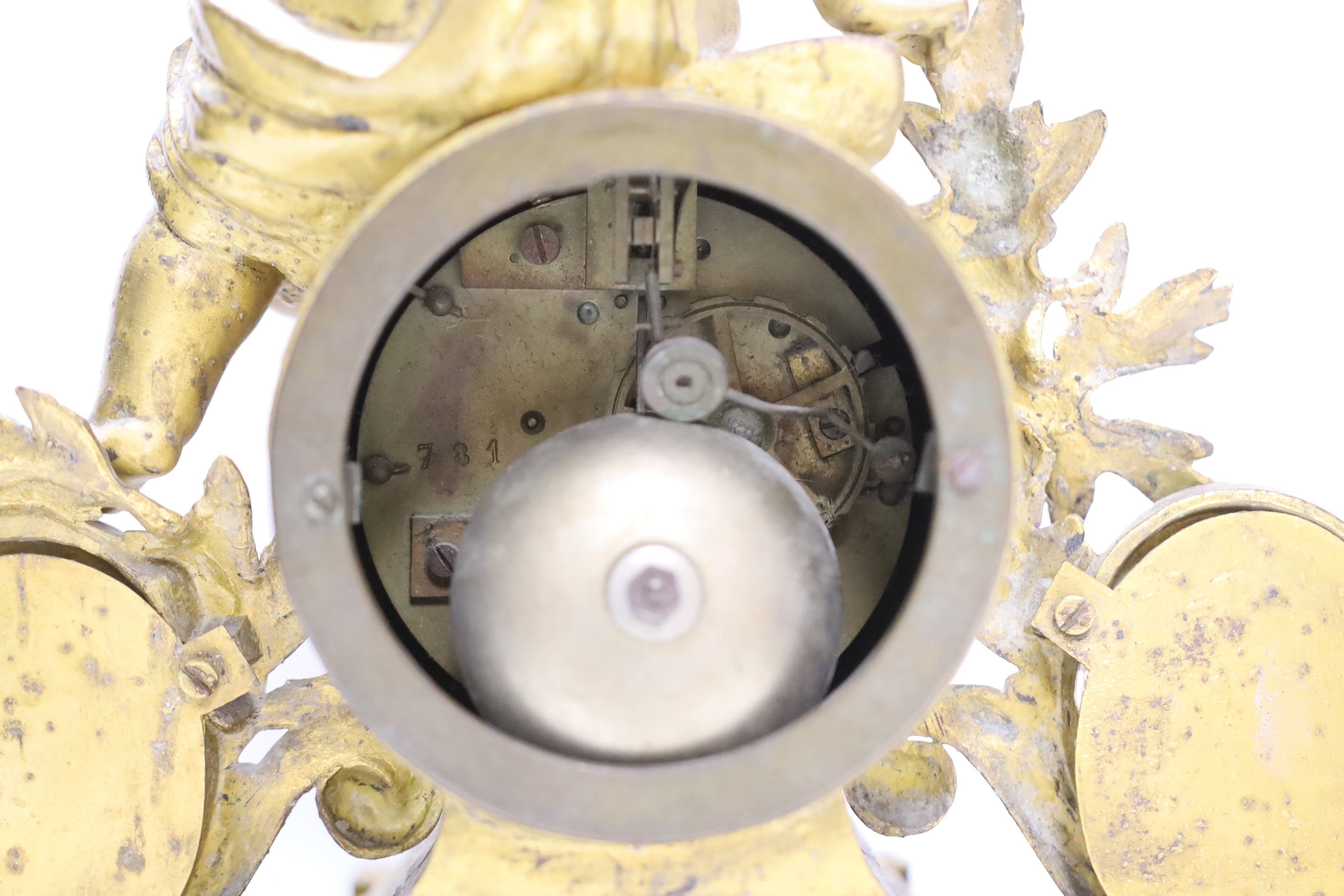 A 19th century ornate French gilt brass and porcelain clock, with two matching two branch candelabra garnitures, clock 31cm high